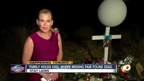 Family holds vigil where missing pair found dead