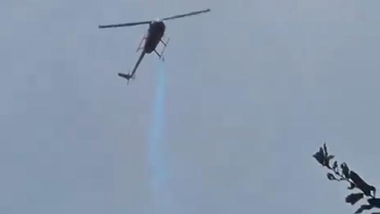 A woman in Florida captured footage of a helicopter spraying a mysterious blue chemical