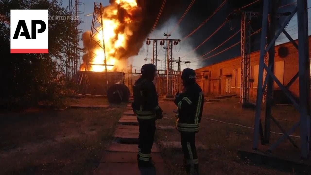 Ukrainian firefighters extinguish flames at electrical substation hit by Russian bombing