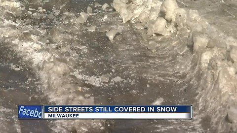 Side streets are still covered in snow leading to traffic jams