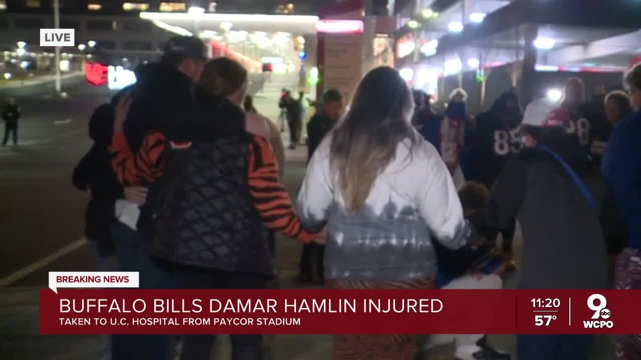 Bengals, Bills fan pray outside Damar Hamlin's hospital