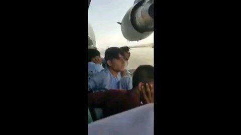 Video recorded by an Afghan shows himself and other Afghans clinging to a US military aircraft