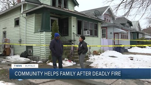 Community members working to help after a deadly house fire on Dartmouth Avenue