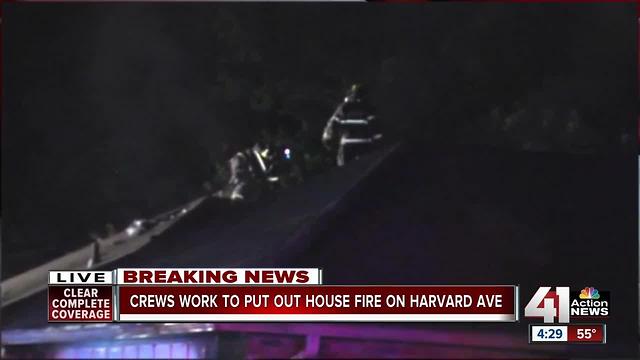 Crews work to put out house fire on Harvard Ave.