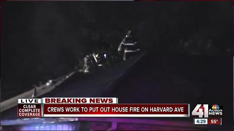 Crews work to put out house fire on Harvard Ave.