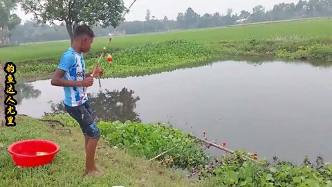 The little boy went fishing by the river and brought home big carp to improve his food +9