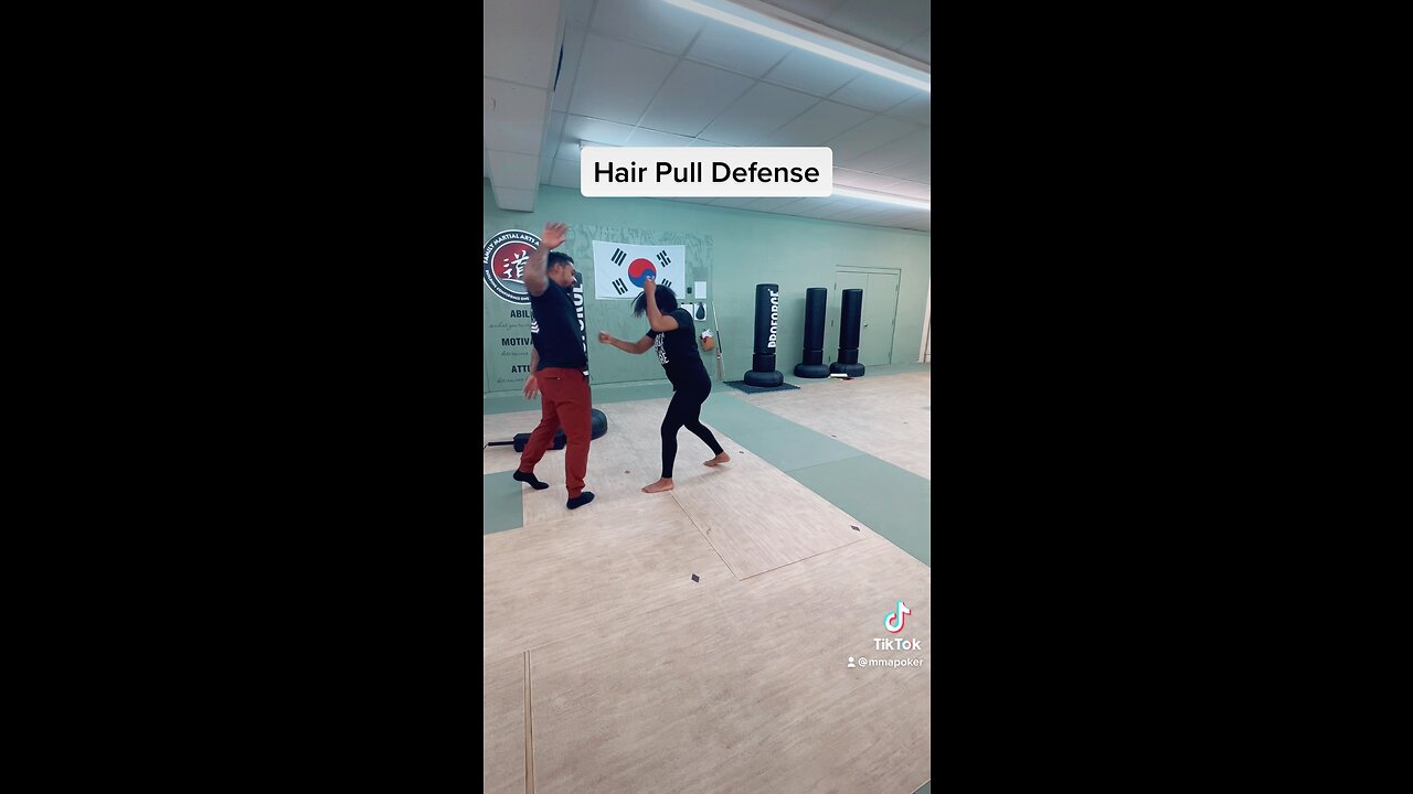 Hair pull defense from the back