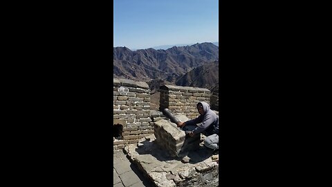 Shooting a cannon on the Great Wall of china