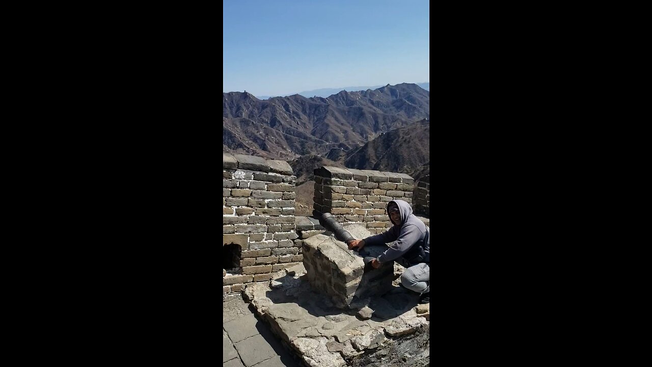 Shooting a cannon on the Great Wall of china