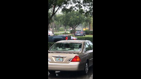 Elderly driver having a bad day in the rain