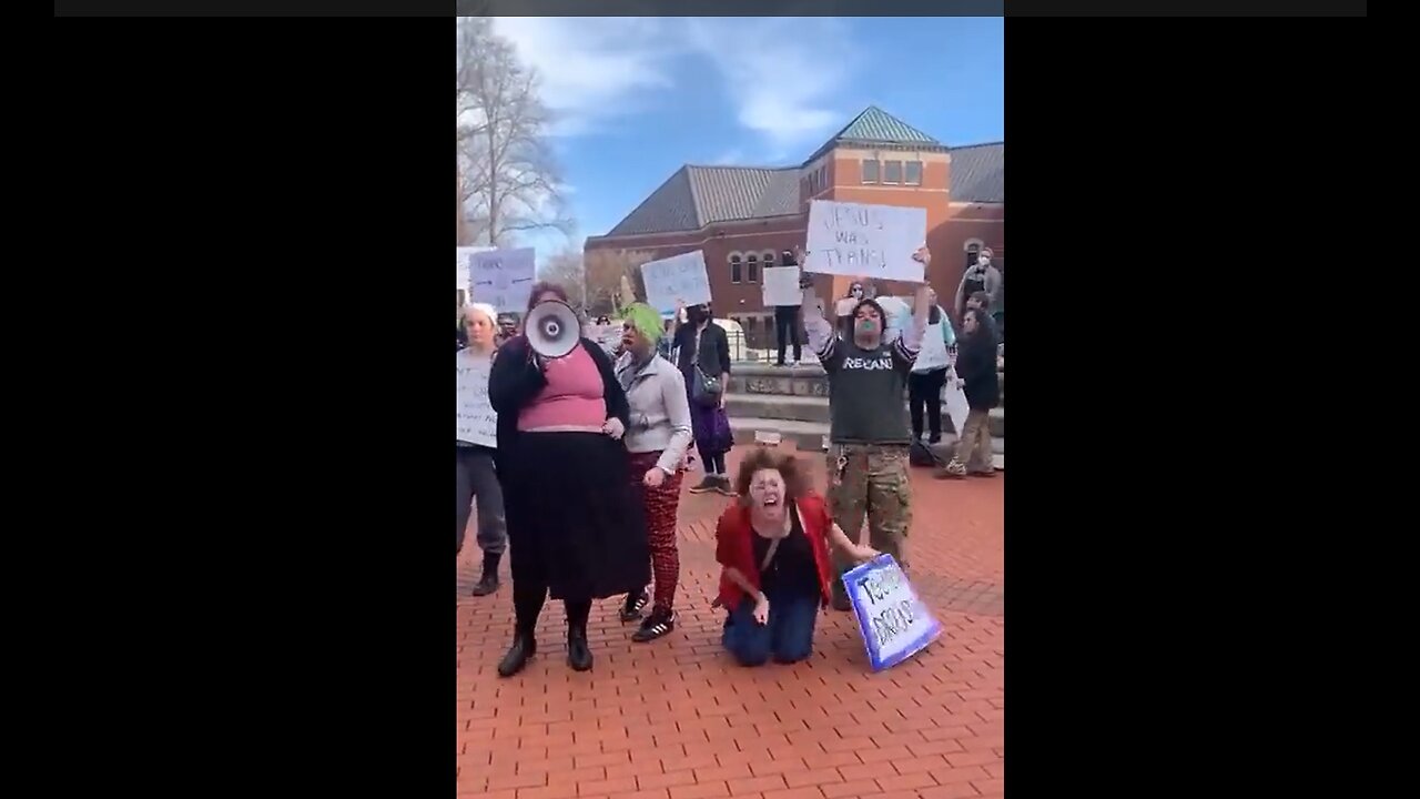 Woman Screams at Transgender Protest, Next to Sign: "JESUS WAS TRANS"