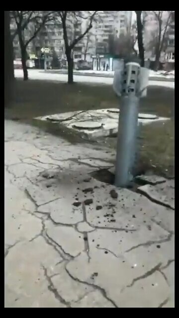 A rocket struck a residential area of Kharkiv embedding itself into the sidewalk.