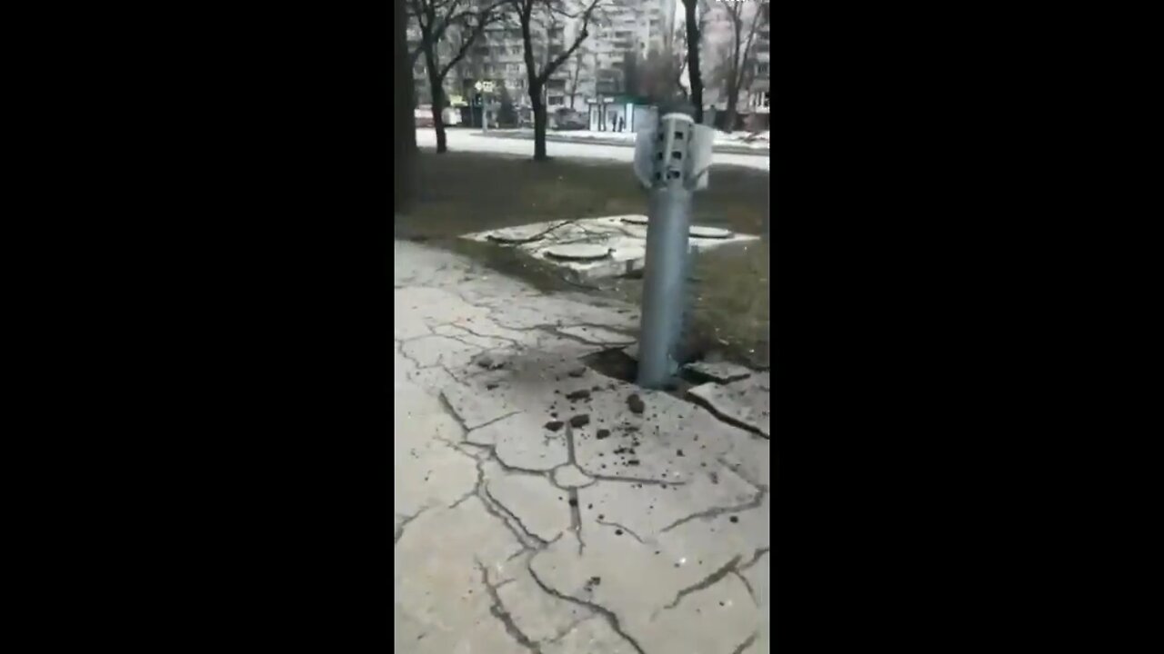 A rocket struck a residential area of Kharkiv embedding itself into the sidewalk.