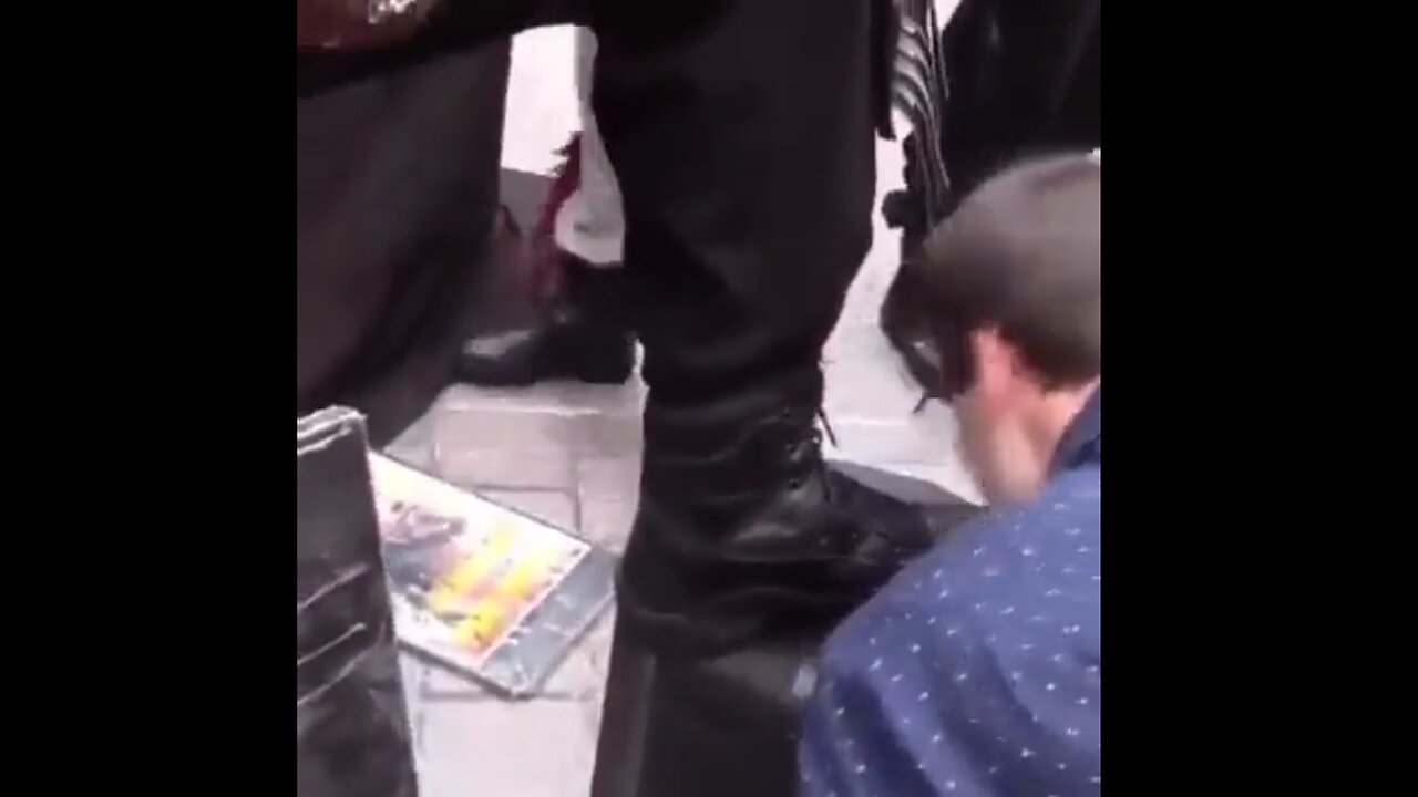 White liberals applaud each other as they line up to kiss black activist's shoe