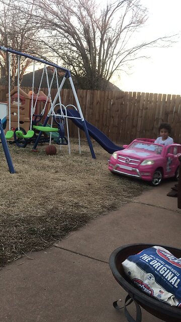 Dragging brother in Barbie car