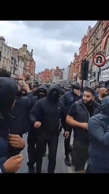 Huge mob descend on Bolton City Centre - looks like they are baying for blood