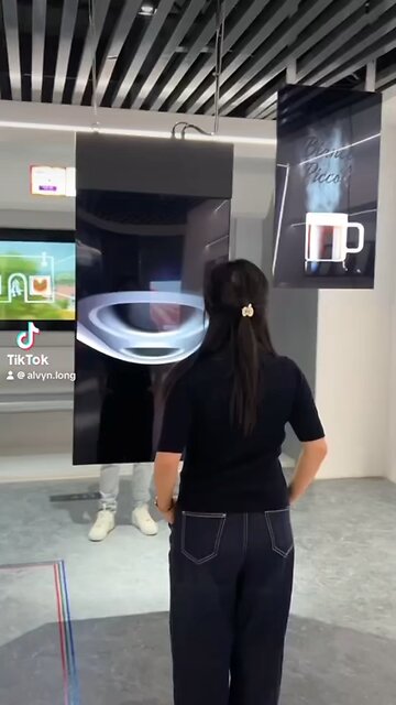 A dual sided OLED advertising display that is as thin as a IPhone And plays two separate videos at 1