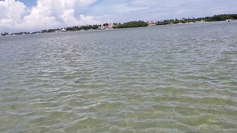 Sandbar astronaut in the ocean