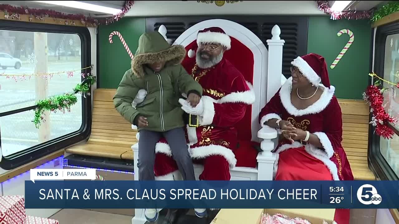 Santa and Mrs. Claus and GCRTA Transit Police spread cheer with holiday trolley