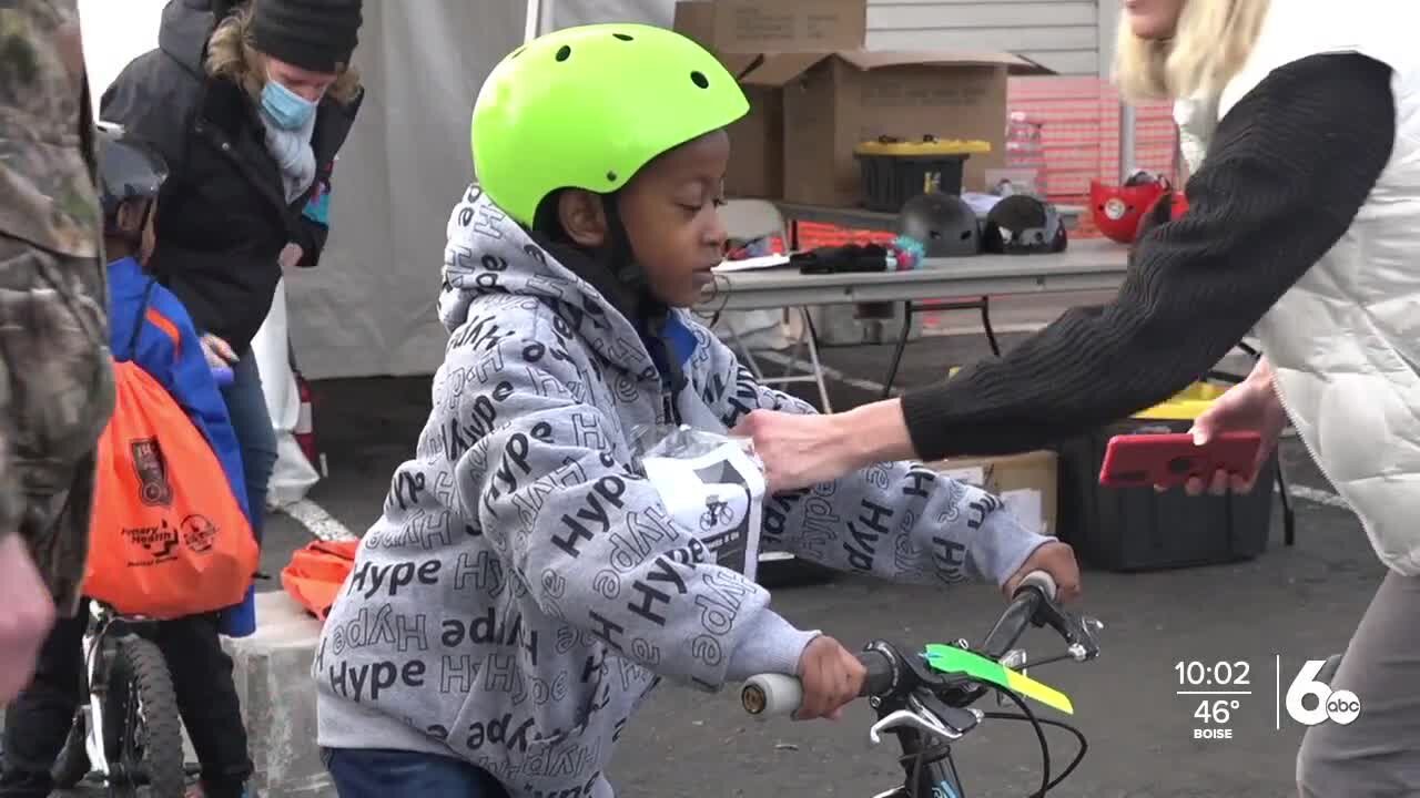 Children receive new bikes at the Boise Bicycle Project holiday giveaway