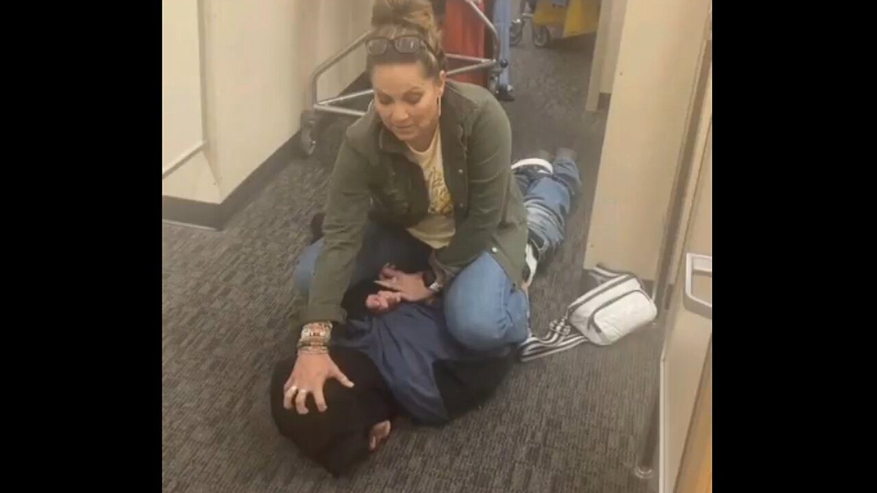 Woman Catches Pervert Filming Her In Fitting Room, Keeps Him in Headlock For 20 Mins