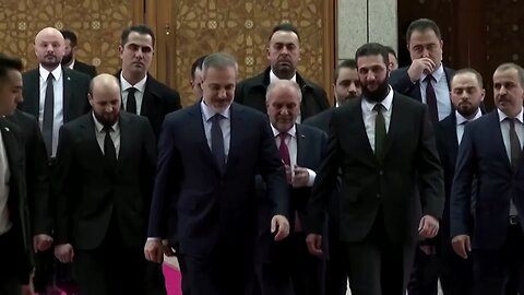Turkey's foreign minister meets with Syria's de facto ruler