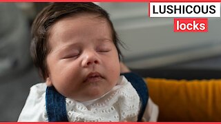Baby born with marvellous head of thick black hair