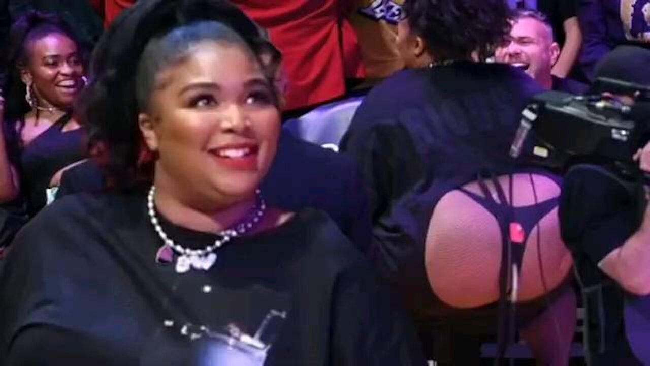 Lizzo celebrates Rumors' success with customised body suit and date.