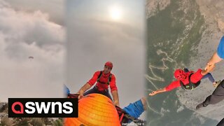 Base jumpers launch themselves from 1,000-meter high cliff into cloudy abyss