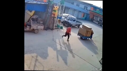 box falls over while guy is loading motorbike and it lands on throttle.