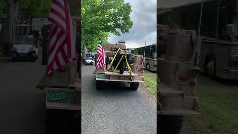 HMMWV with military motorcycle in the back