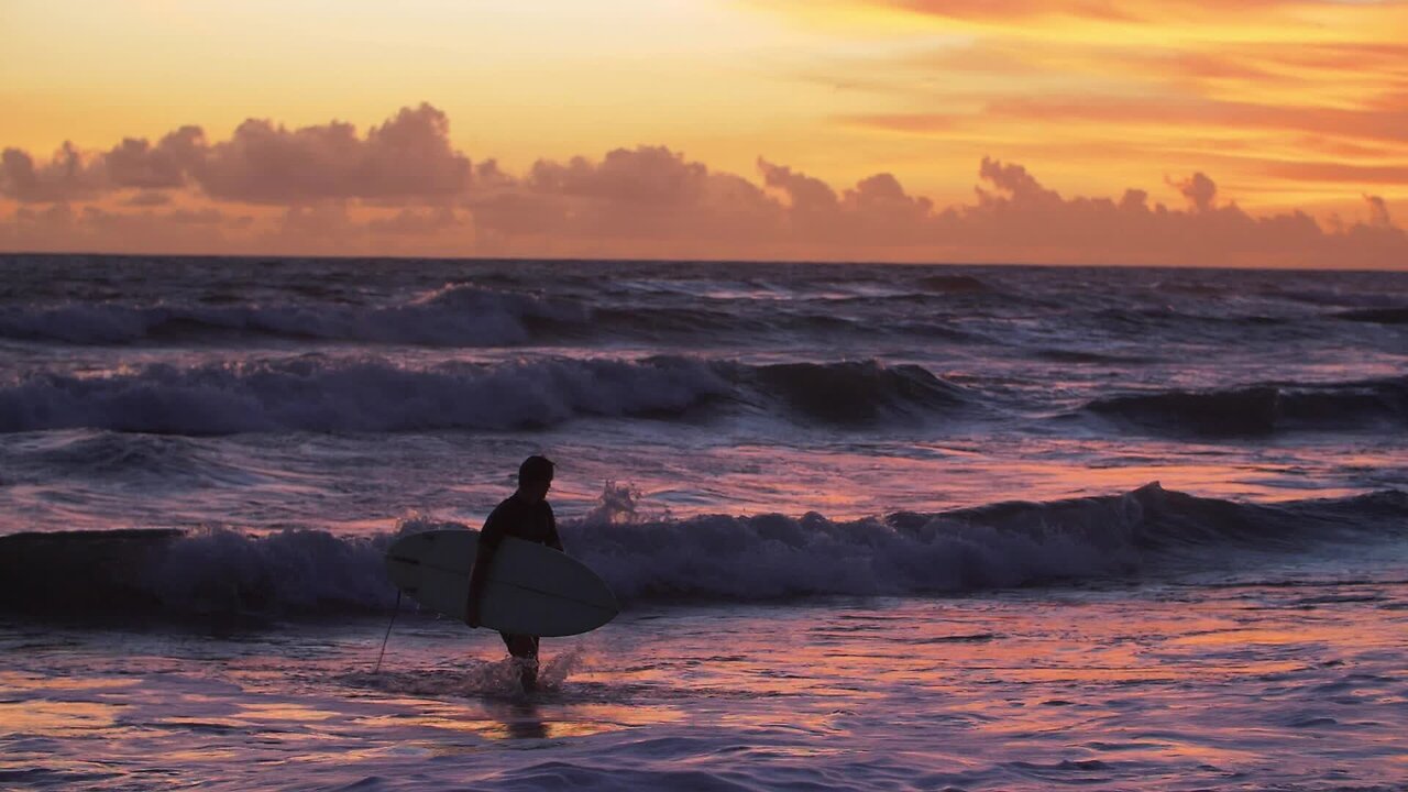 Surfer on his way out of the waves code