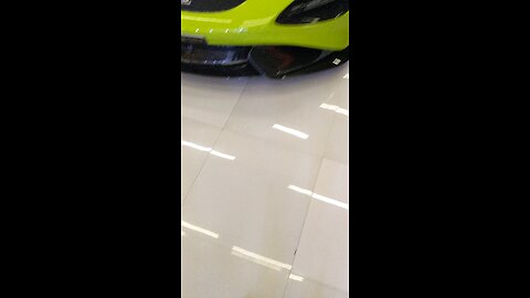McLaren 765LT green with black interior outside carbon fiber