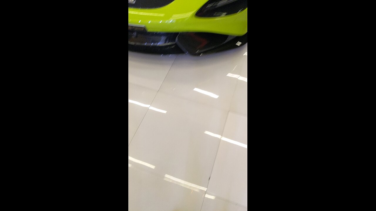 McLaren 765LT green with black interior outside carbon fiber