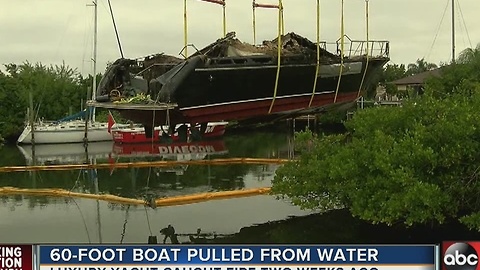 60-foot boat pulled from water after catching fire