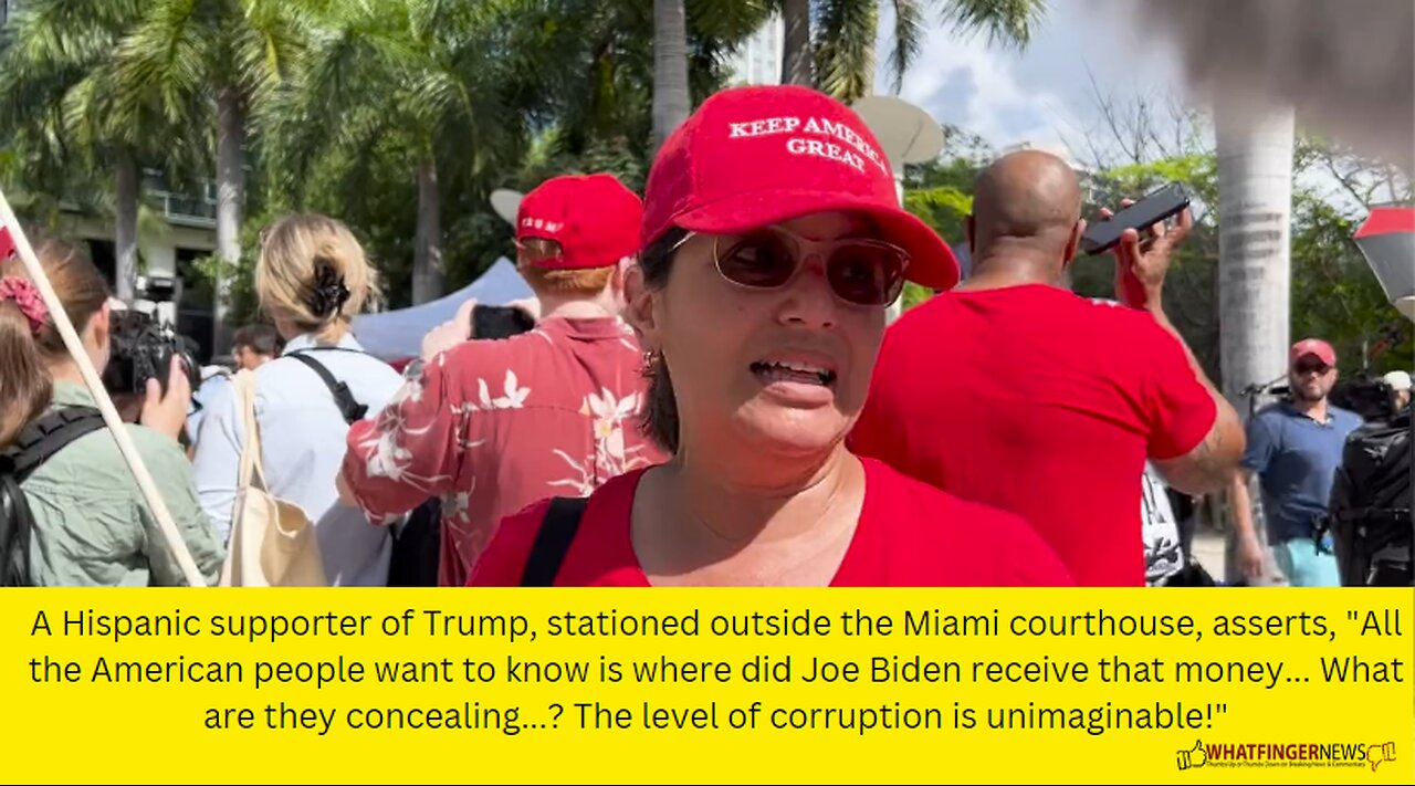 A Hispanic supporter of Trump, stationed outside the Miami courthouse,