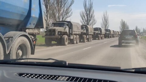 A huge column of Russian and DPR troops & vehicles waiting to move into Donbass