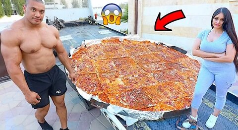 Worlds Strongest Man Eating Worlds Largest Pizza *WORLD RECORD*