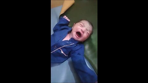 Cute Newborn baby with blue clothes