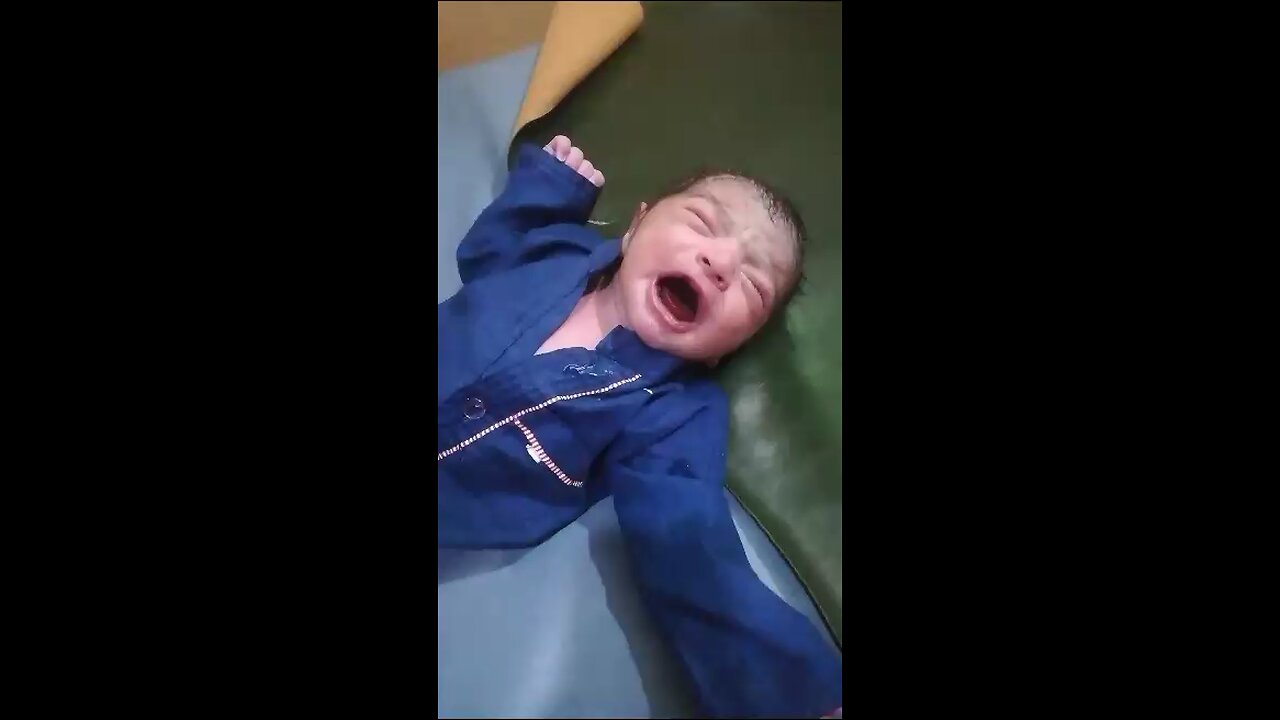 Cute Newborn baby with blue clothes