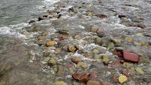 Water running down a river in Colorado during the summer