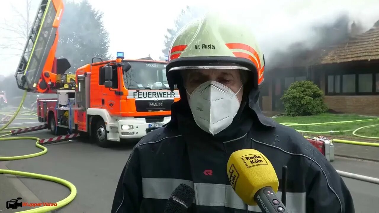 19. Smoke billows from thatched cottage fire