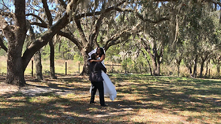 Bride and Groom having fun during their wedding photo shoot