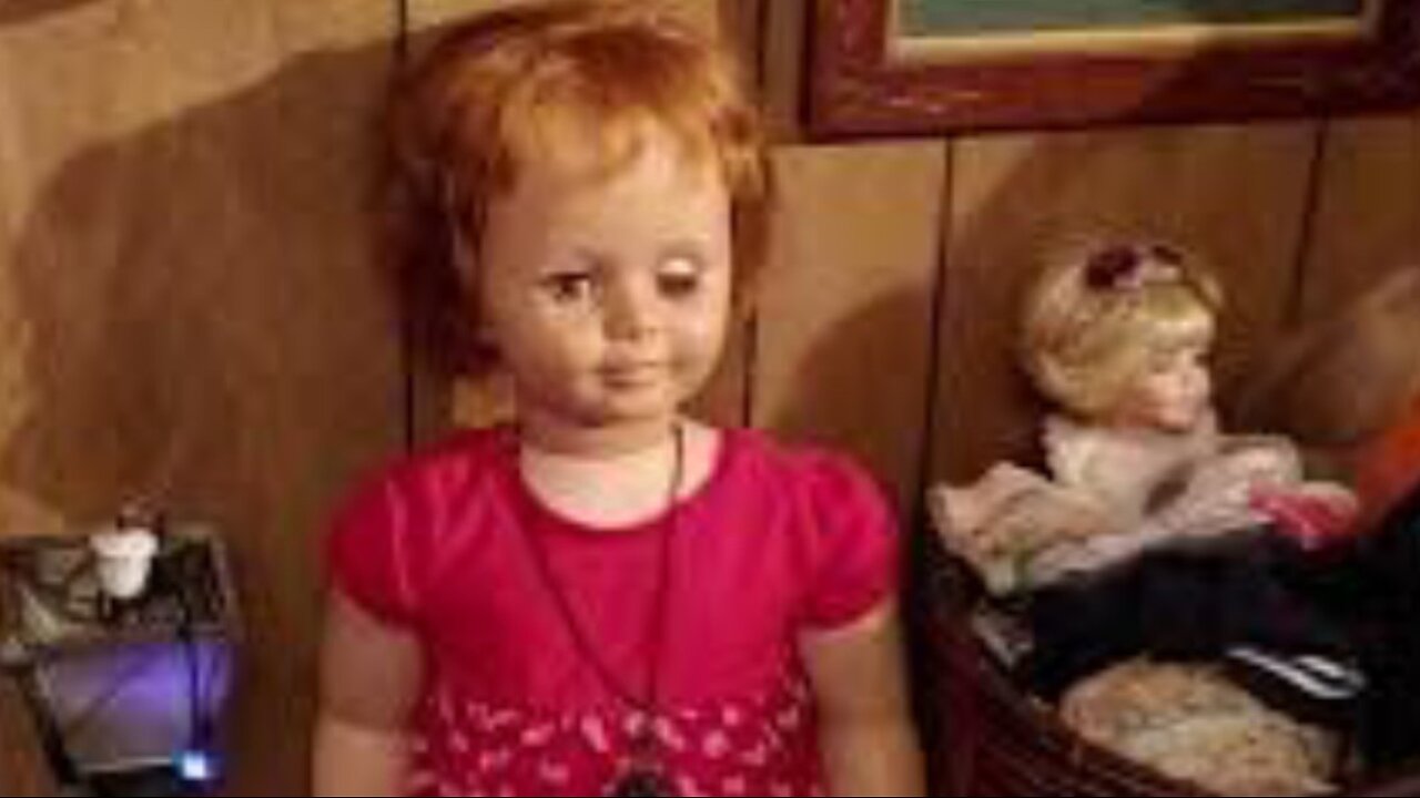 Haunted spirited doll moves eyes watch in video