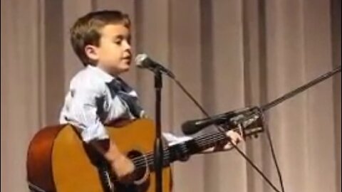 Boy Masters Guitar During Johnny Cash Cover Performance