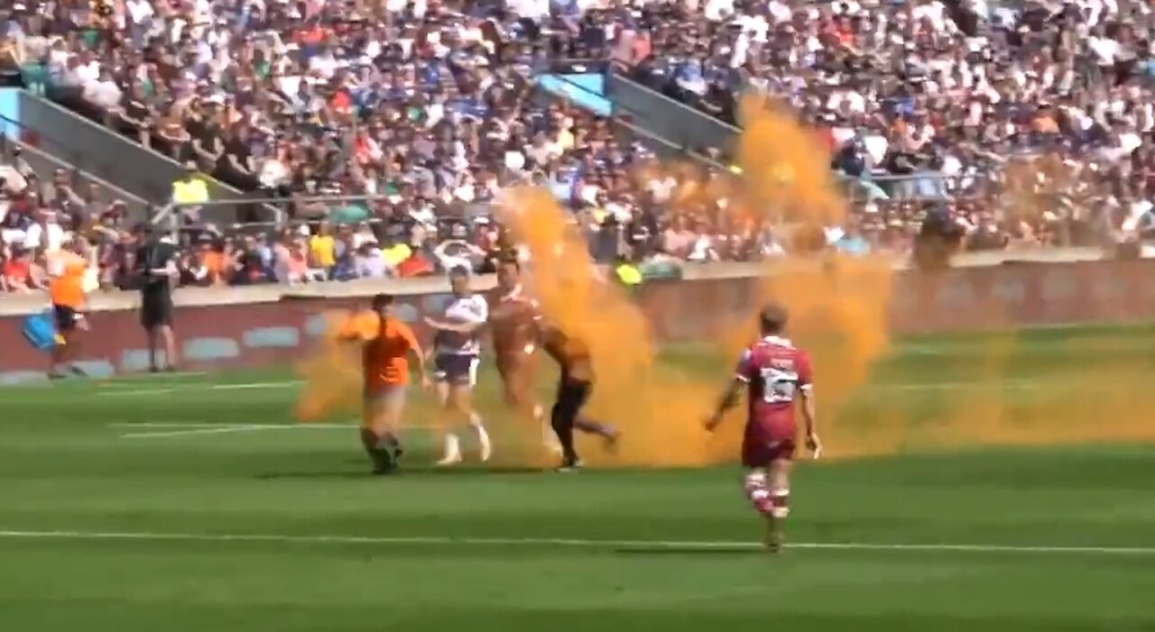 Climate Crazies Run On Rugby Field and Throw Orange Paint On Players