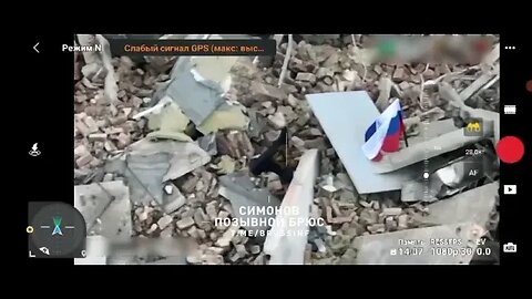 Flags of Russia and the Wagner PMC over over the ruins of the Bakhmut city administration