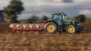 John Deere 6930 ploughing after maize