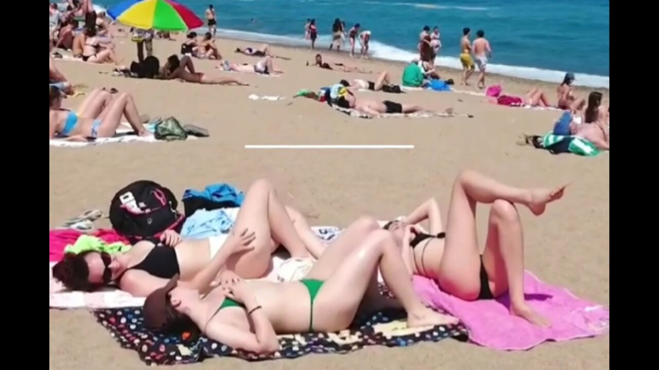 Enjoying the sun on the beach in Spain ।। स्पेन के बीच पर, धूप का मजा लेते हुए ।।