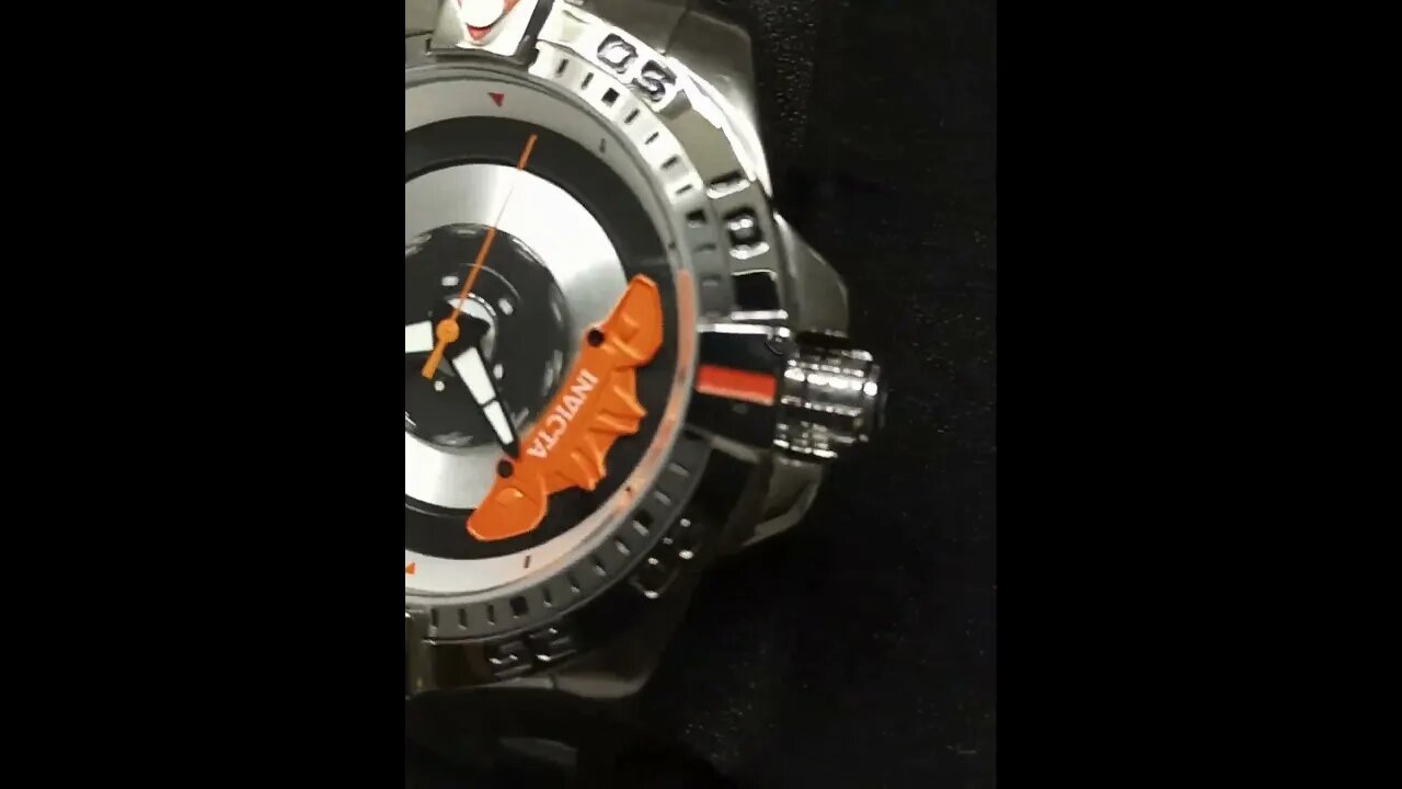 orange caliper on wheel automatic watch stainless steel bracelet